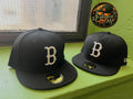 New Era 59Fifty negra presenta el logotipo "B" bordado en blanco de los Boston Red Sox en la parte delantera.
