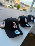 Gorra Snapback New Era 9FORTY A-Frame de Los Angeles Dodgers destaca por su corona estructurada negra y un parche lateral conmemorativo de los Juegos Olímpicos de 1984
